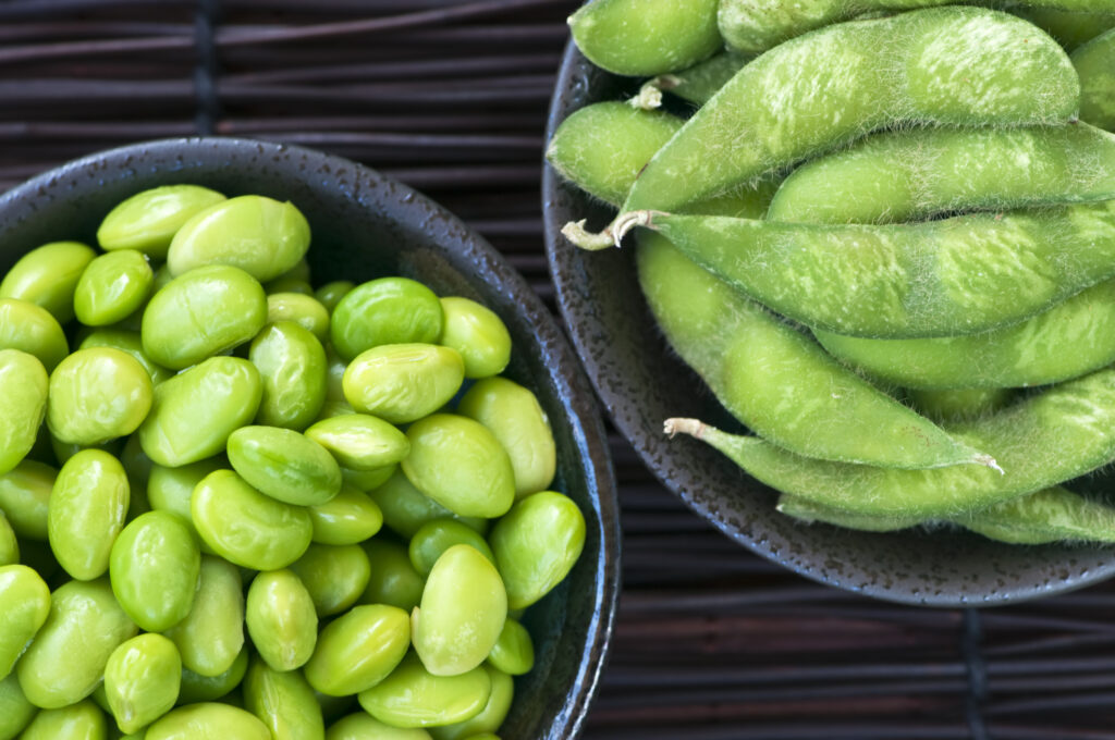 Close-up of edamame beans in bowls — soybeans are a natural source of phytoestrogens called isoflavones.