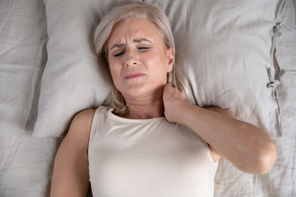 Woman experiencing morning stiffness and joint pain during menopause